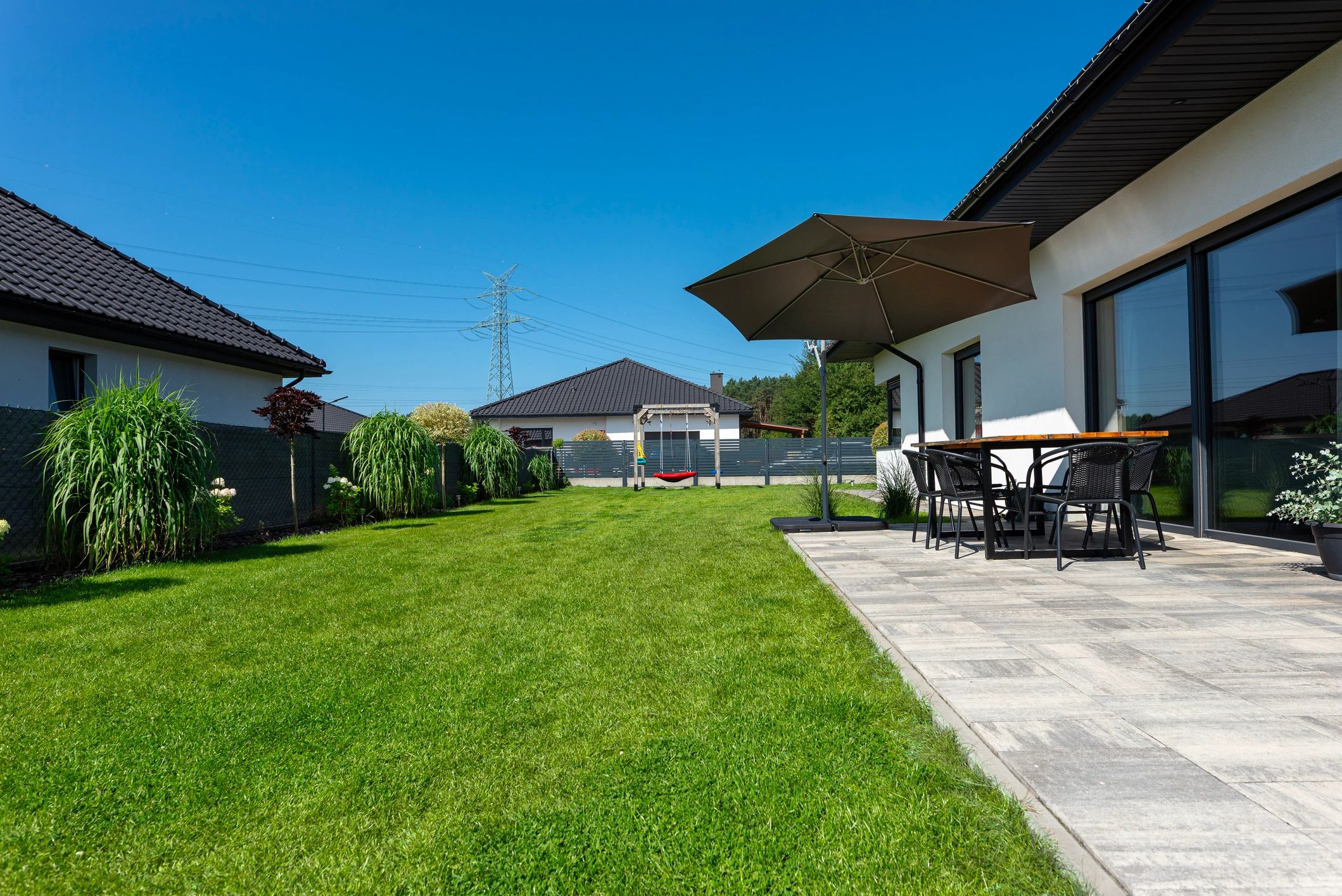 Backyard patio and landscaped lawn